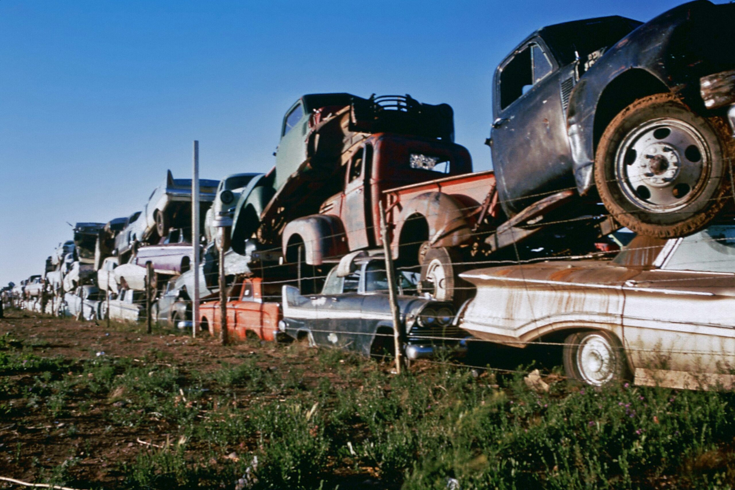 Old cars in a junkyard.